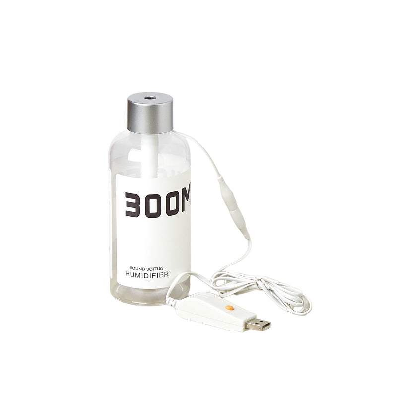 Clear bottle humidifier with 'BOOM' branding and USB cable on a white background