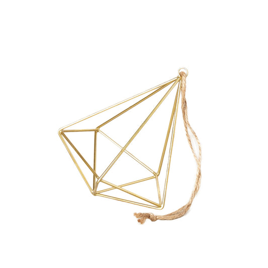 Gold geometric wall art with a string on a white background