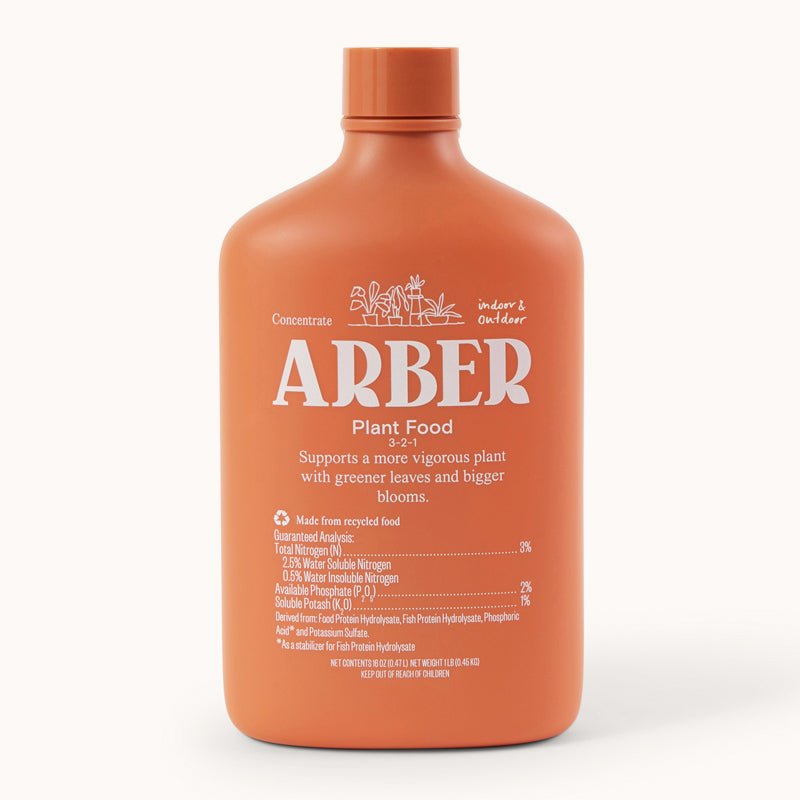 Orange 16oz Arber Organic Plant Food bottle with white label text for indoor & outdoor use.
