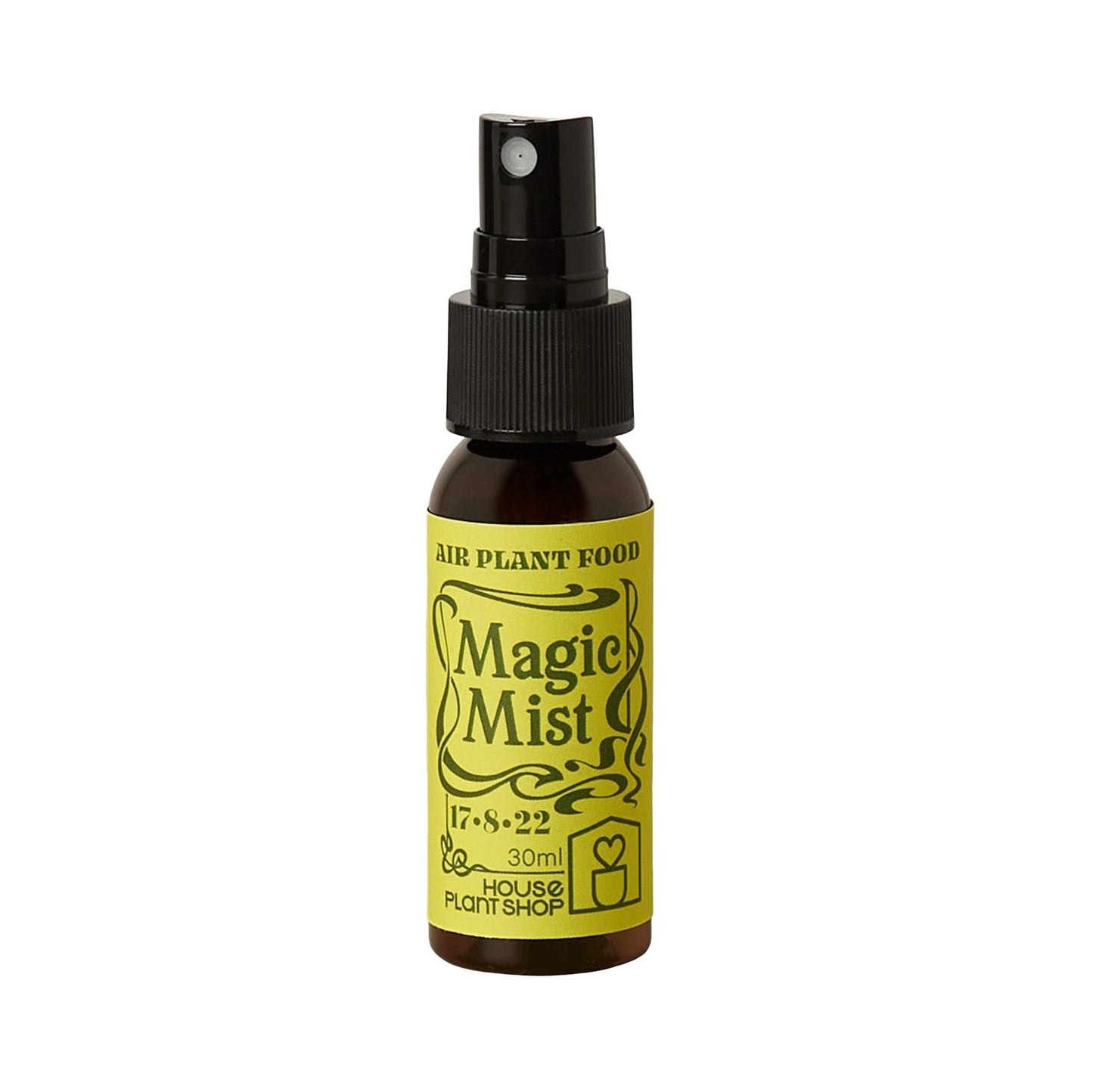 Small brown spray bottle of Magic Mist Air Plant Food with a yellow label.