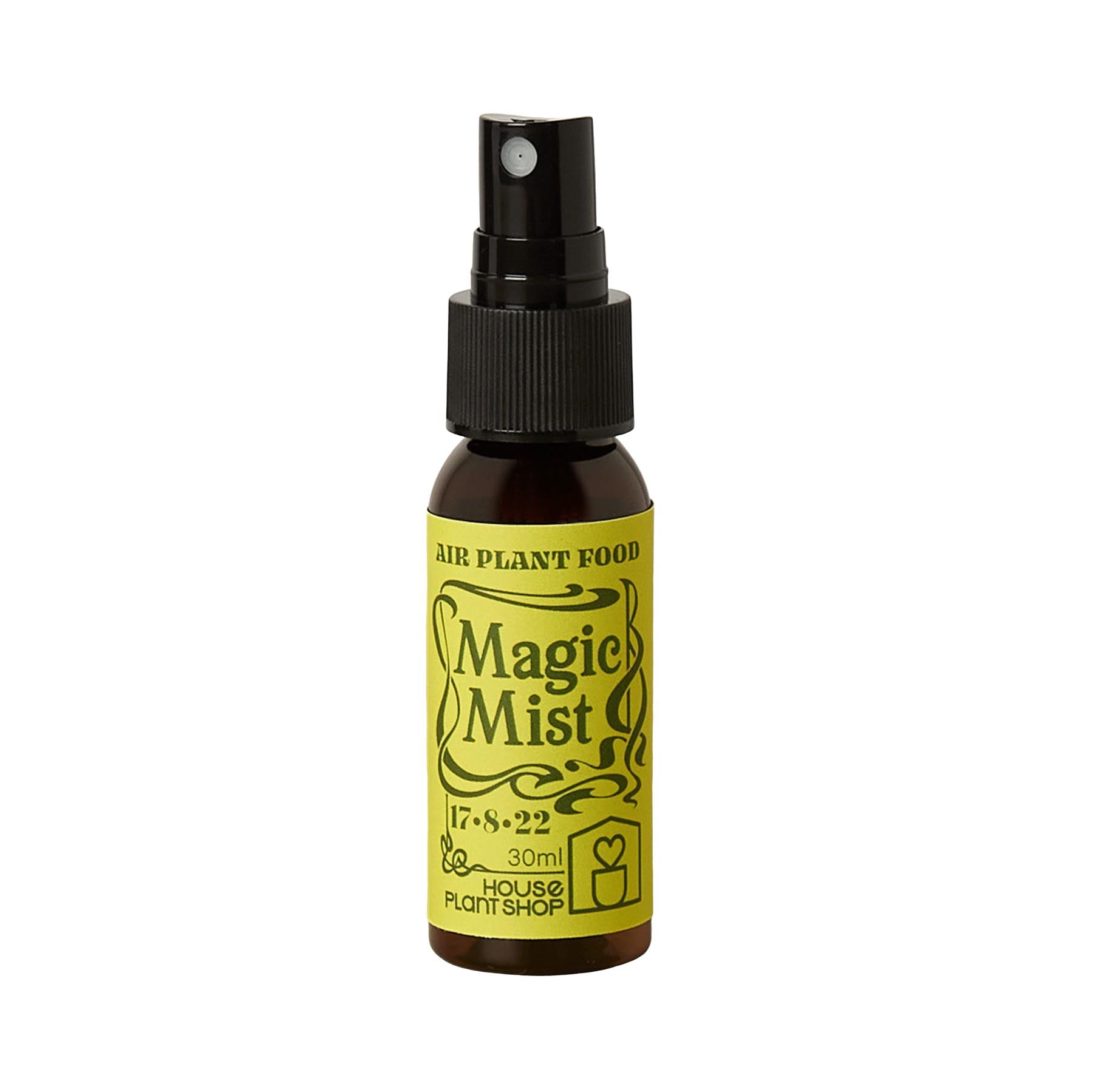 Small brown spray bottle of Magic Mist Air Plant Food with a yellow label.